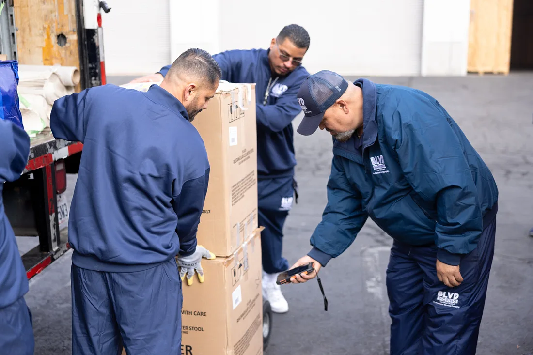 BLVD mover scanning organized cartons during inventory work