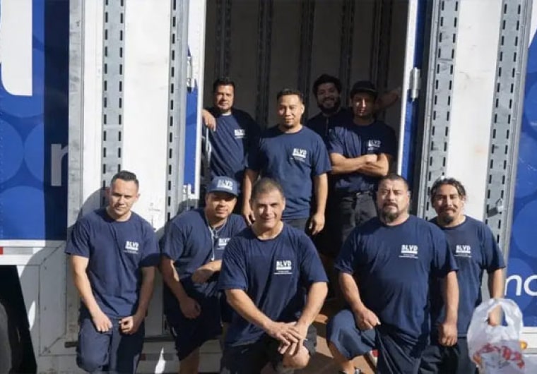 Photo of at least 9 of the BLVD moving team